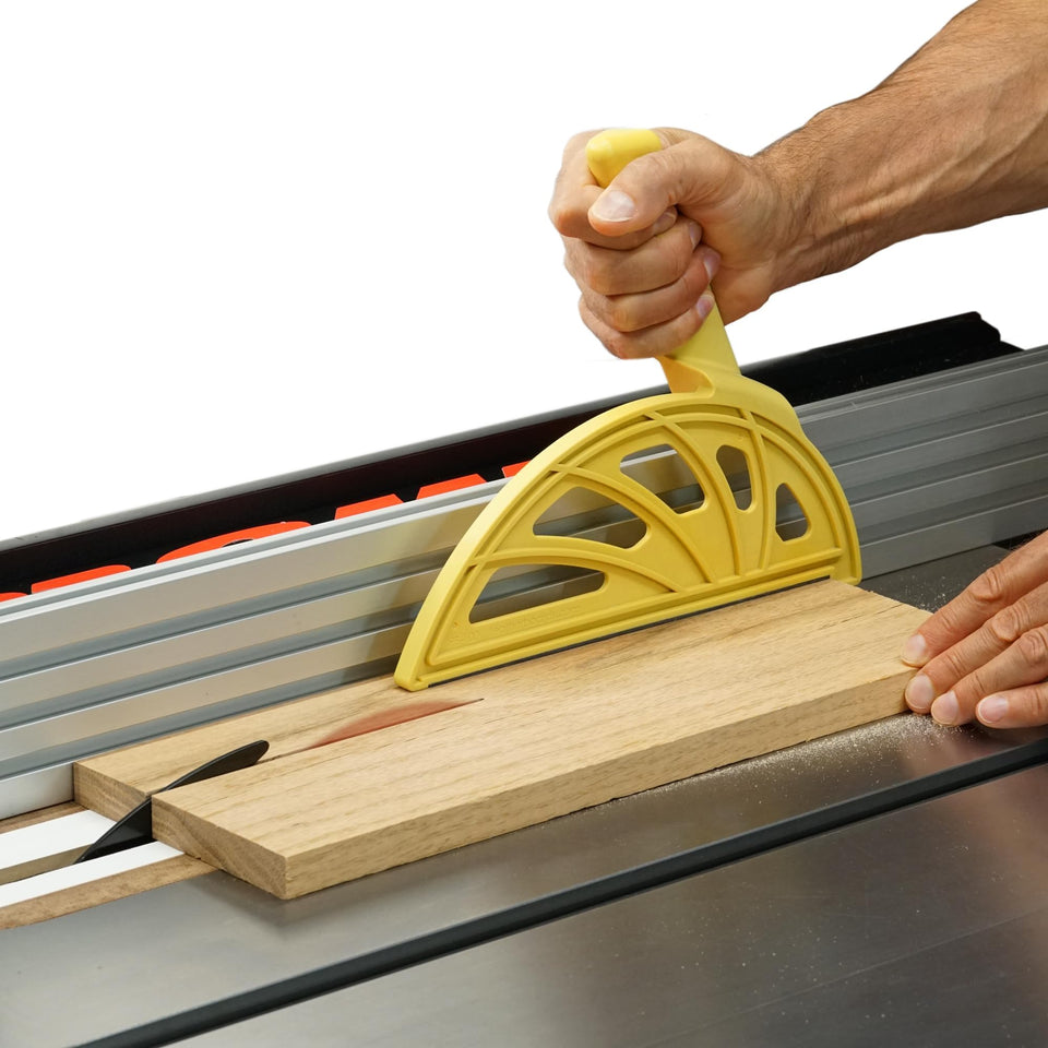 The Hedgehog push block with offset handle guiding table saw cuts safely and precisely.