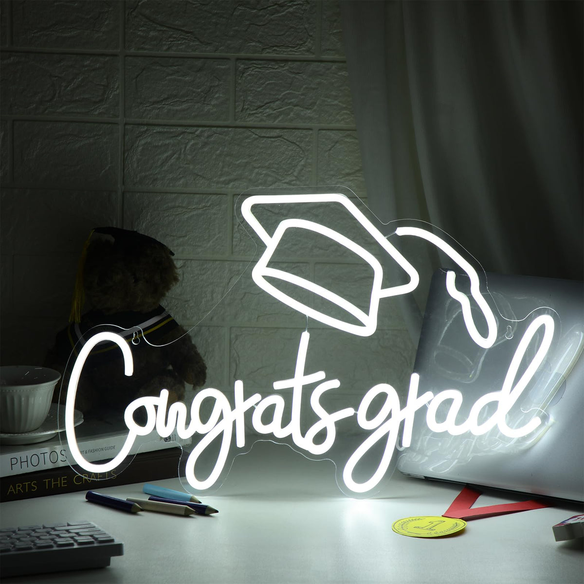 Threan congrats grad sign on desk display for low-profile ambiance.