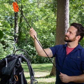 Tie Boss compact unit demonstrates one-handed operation for easy use.
