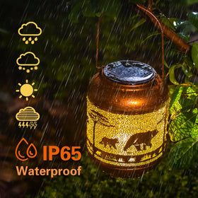TIGGSY bear solar lantern at night creating inviting pathway ambience