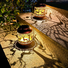 TIGGSY antique bronze openwork lantern enhances garden decor with artistic lighting.