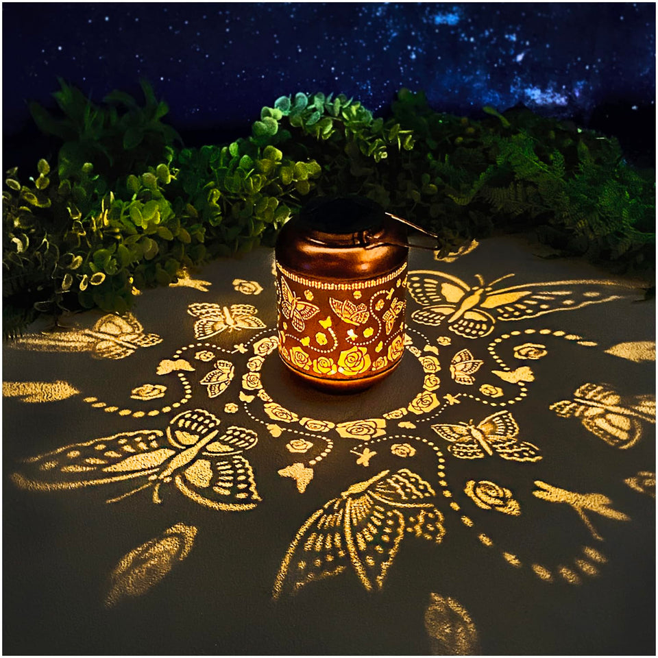 TIGGSY Butterfly Solar Lantern casting butterfly-pattern shadows at dusk.