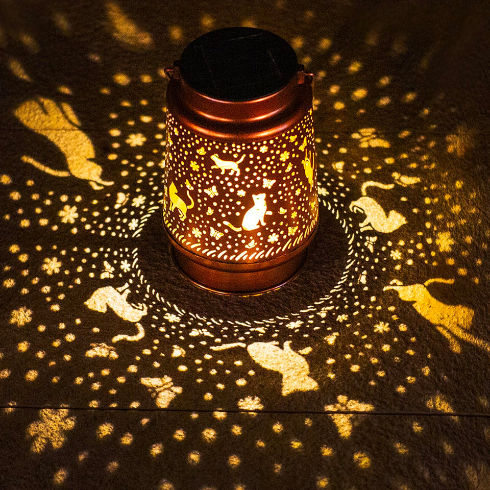 TIGGSY Cat Solar Lantern main view highlighting warm garden lighting at dusk.
