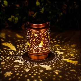 TIGGSY Cat Solar Lantern showing decorative pattern projected at night.