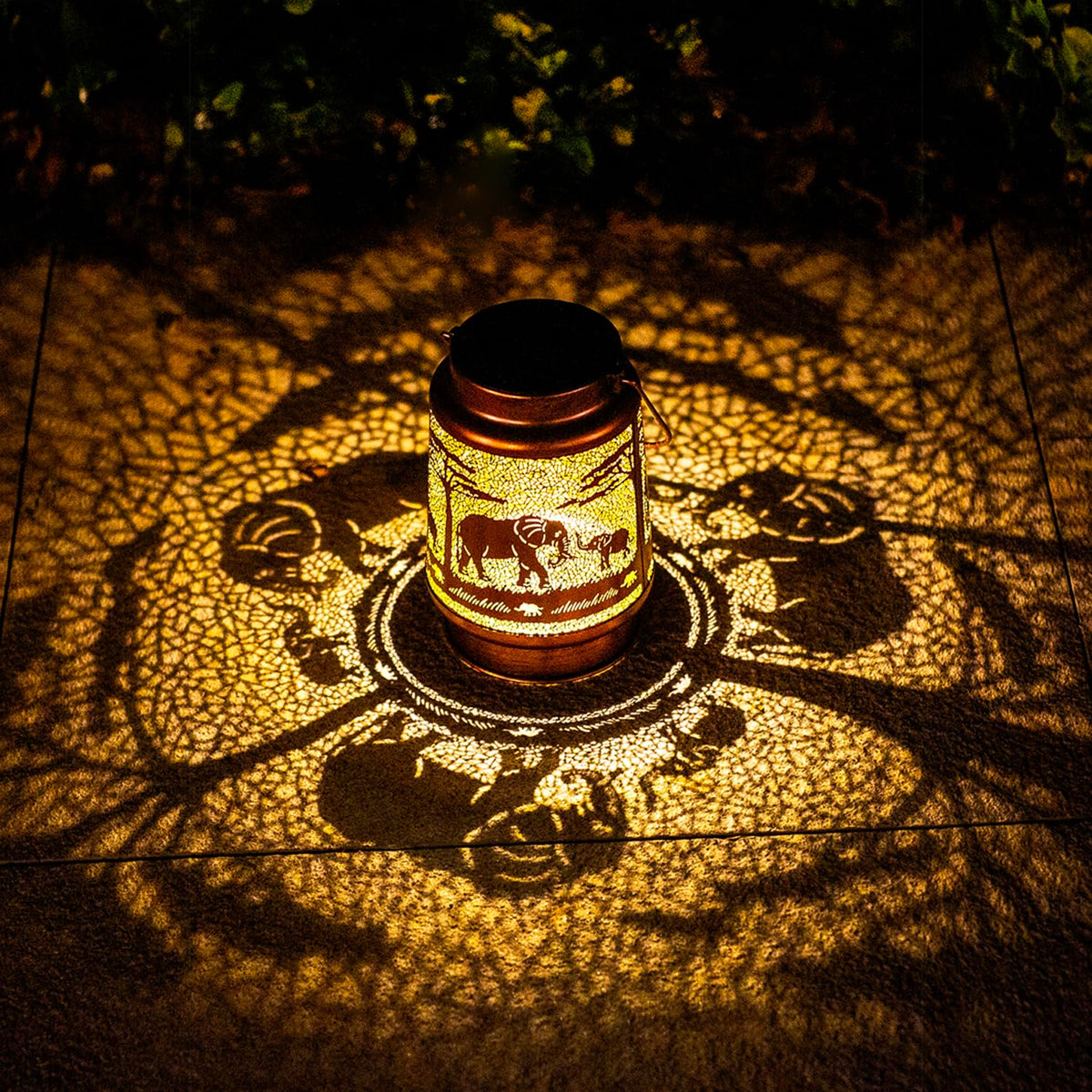 TIGGSY Elephant solar lantern displays pattern glow for garden ambience.