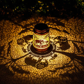TIGGSY Elephant solar lantern displays pattern glow for garden ambience.