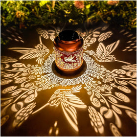TIGGSY hummingbird solar lantern pattern projection for warm garden ambience
