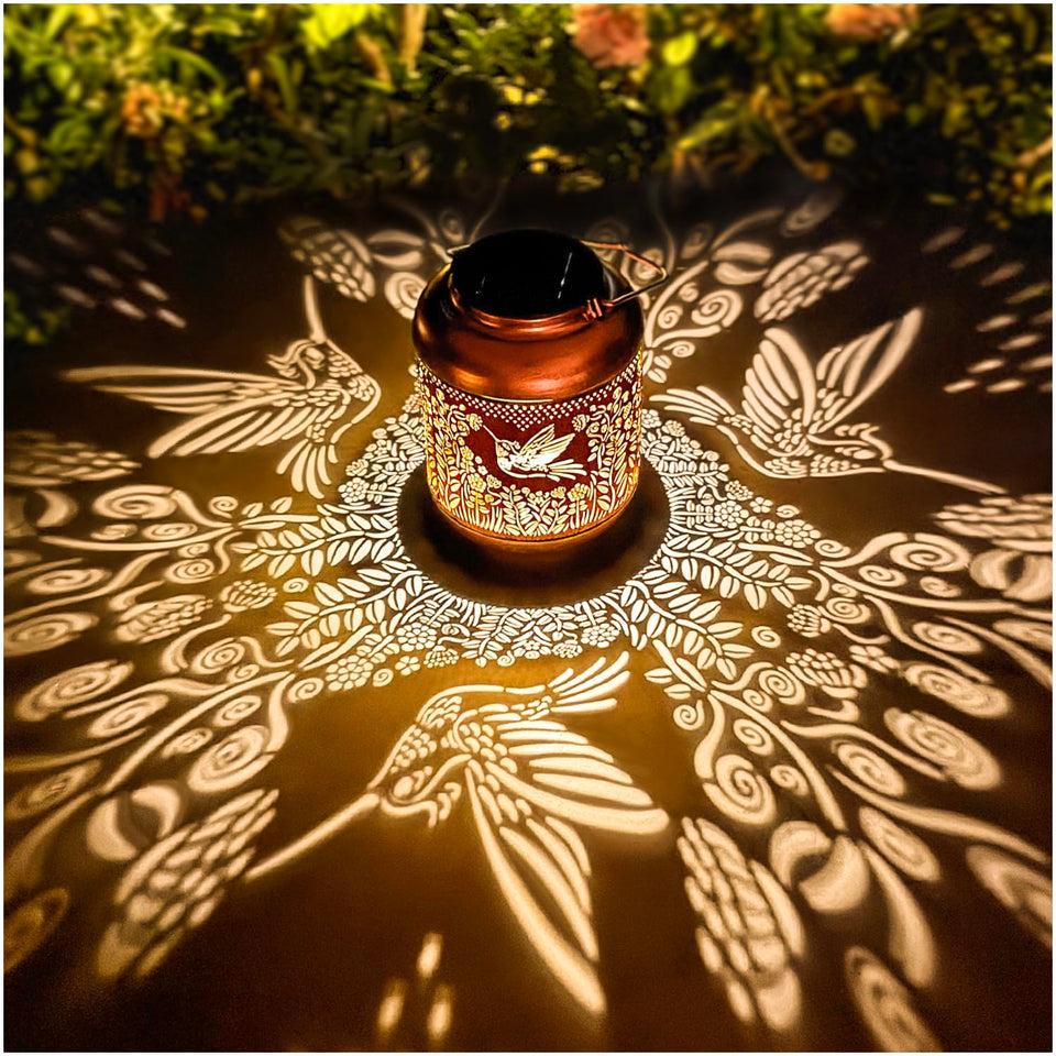 TIGGSY hummingbird solar lantern pattern projection for warm garden ambience