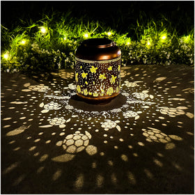 TIGGSY Sea Turtle solar lantern outdoors creates warm garden ambience at night.