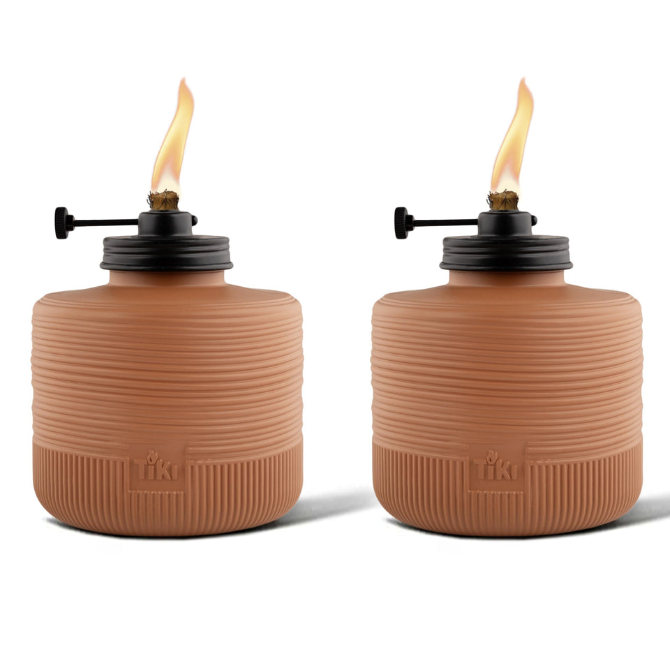 TIKI Amber Horizon table torch with adjustable flame for cozy outdoor ambiance.