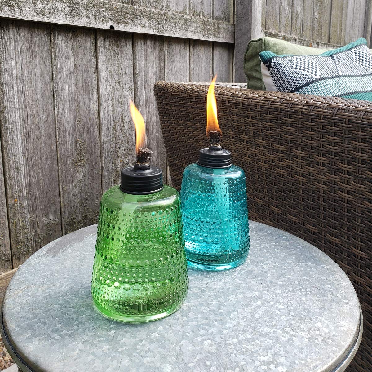 TIKI Carnival Glass Torch green lit for cozy backyard evenings