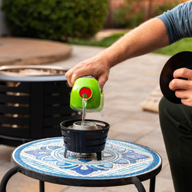 TIKI Mini Pit Table Torch outdoor decor adds warm glow to any backyard gathering.