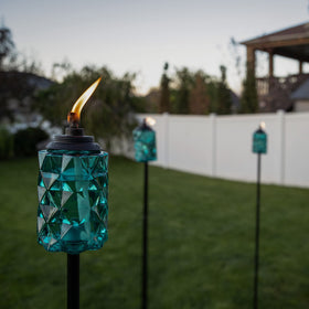 TIKI Topaz Blue 50-inch torch for flexible garden lighting setups.
