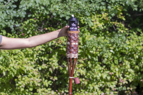 TIKI torch canister with fiberglass wick delivering a steady flame in use.
