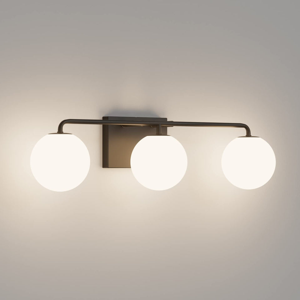 Tipace 3-light vanity fixture with black matte finish and white glass globes for bathroom drama