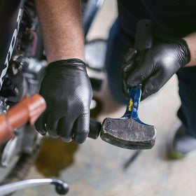 Professional appearance of TitanFlex black nitrile gloves in use