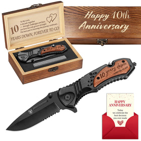 Titorld 10-year anniversary pocket knife beside a gift box for a keepsake.