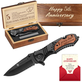 Titorld five-year anniversary knife with engraved wooden handle for keepsake.