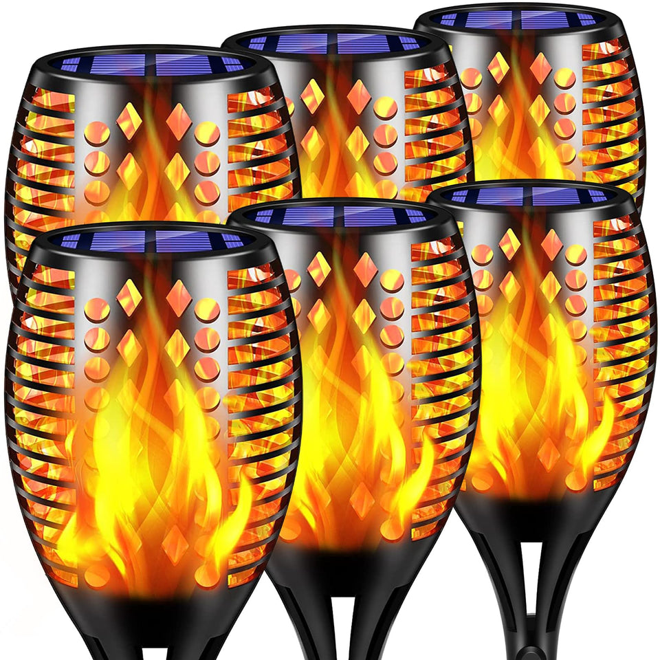 TomCare solar lights with flickering flames provide a warm, inviting glow for outdoor gatherings.
