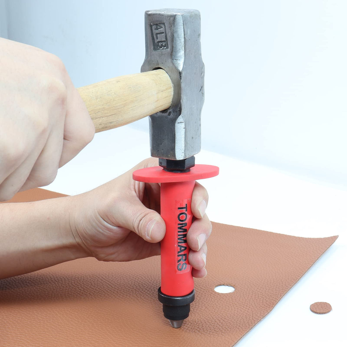 TOMMARS leather punching use demonstrating precise hole placement for crafts.