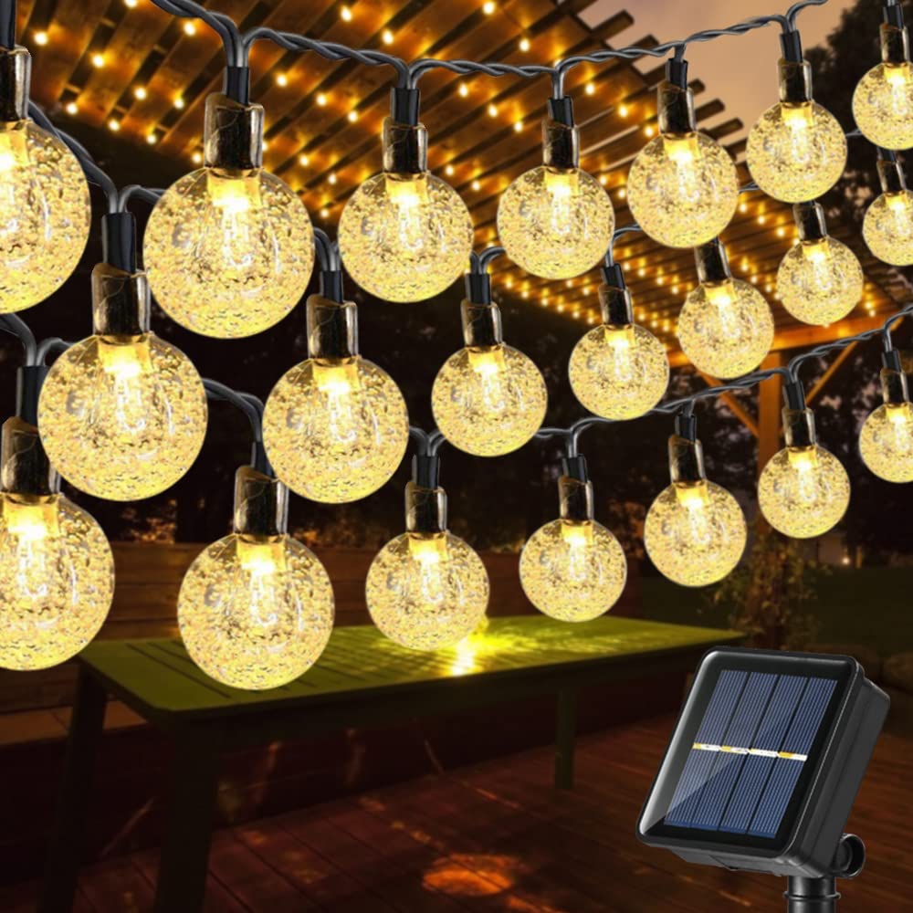 Toodour solar string lights with 100 LED globes illuminate outdoor spaces with warm, energy-efficient glow.
