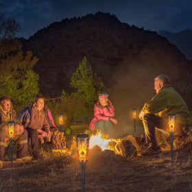 Toodour lighting creates party-ready ambiance with flickering flames outdoors.