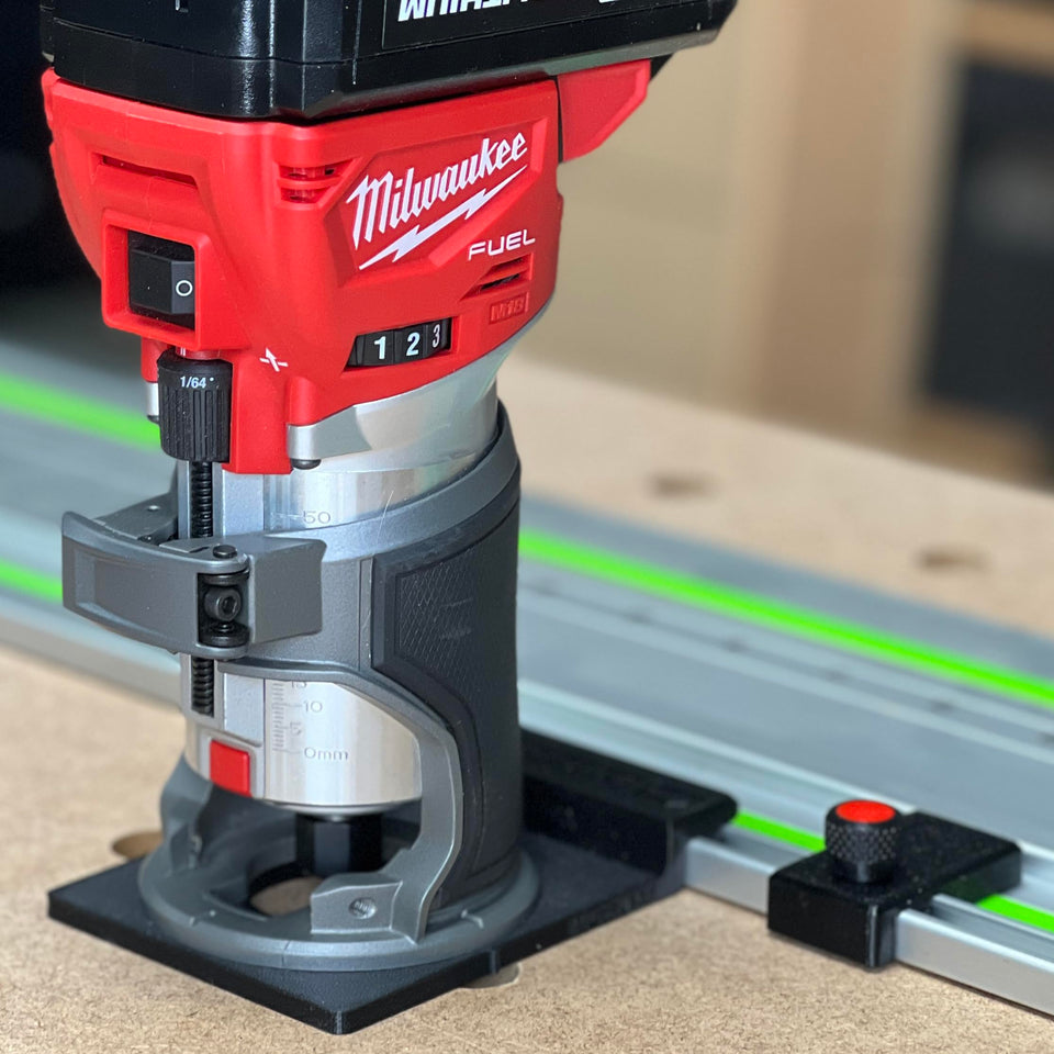 ToolCurve guide rail adapter attached to Milwaukee router for precise setup along a track rail.