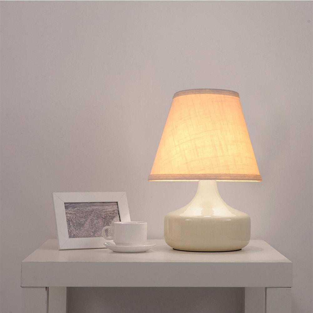 Tootoo Star barrel white lamp shade assembled on lamp provides soft ambient light