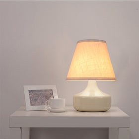Tootoo Star barrel white lamp shade assembled on lamp provides soft ambient light