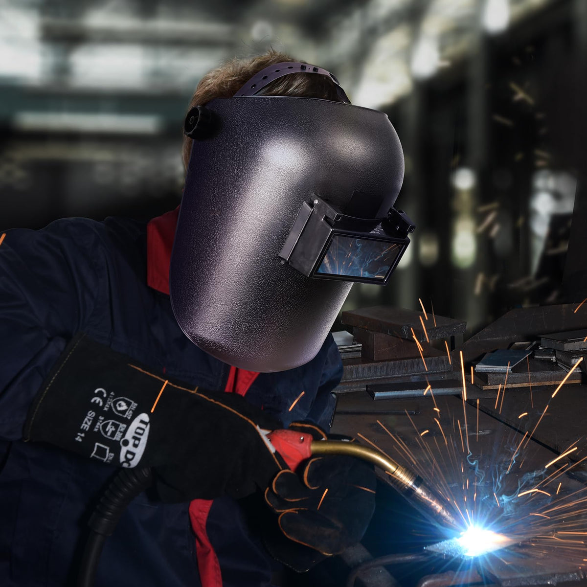 TOPDC welding helmet in use during welding shows visibility and protection in real-world setup