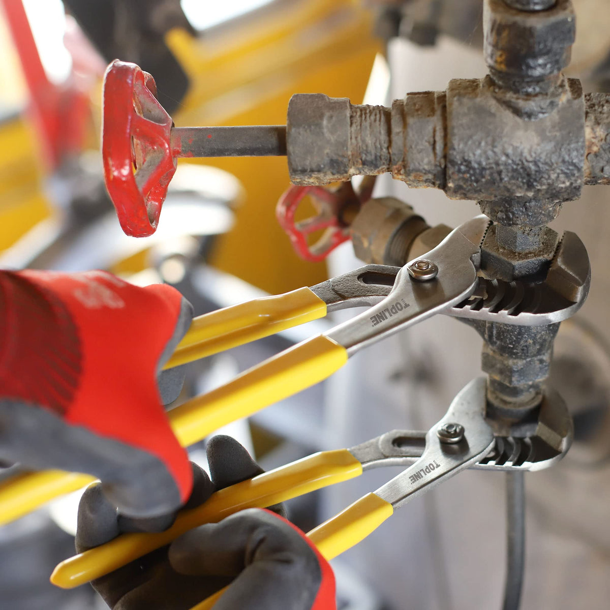 Topline pliers in a plumbing setup demonstrating versatile general repairs