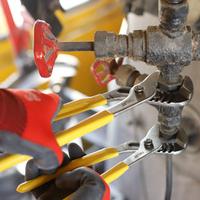 Topline pliers in a plumbing setup demonstrating versatile general repairs