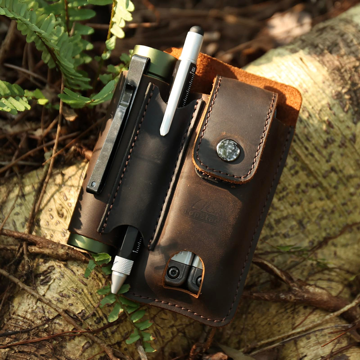 Dark brown leather Topstache multitool sheath highlights premium material and protection.