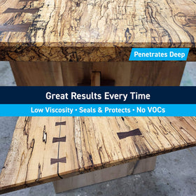 TotalBoat epoxy being brushed onto rotted wood for restoration.