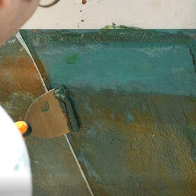 TotalStrip being rinsed off with water after stripping on fiberglass.