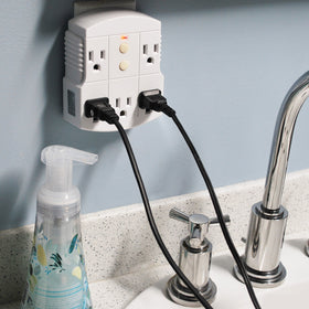 Tower GFCI 5-outlet adapter in use powering indoor tools and electronics safely