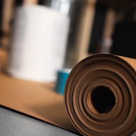 Edge of X-Paper roll secured to guard flooring during projects.