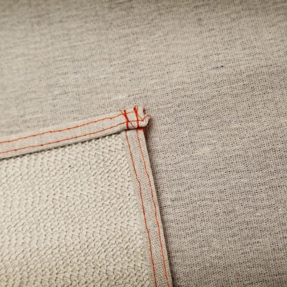 Trimaco Stay Put Canvas Plus drop cloth back grip view showing non-slip backing in action