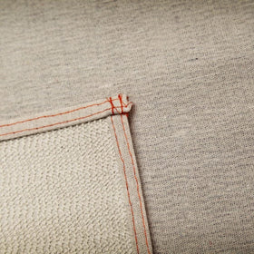 Trimaco Stay Put Canvas Plus drop cloth back grip view showing non-slip backing in action