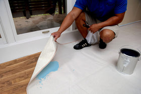 Leak-resistant center of Trimaco Stay Put Canvas Plus drop cloth protecting floors