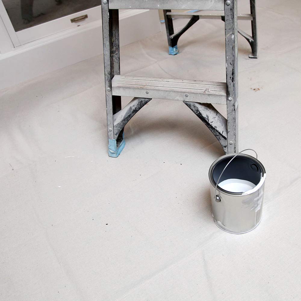Non-slip backing of Trimaco Stay Put Canvas Plus drop cloth stabilizing on floor