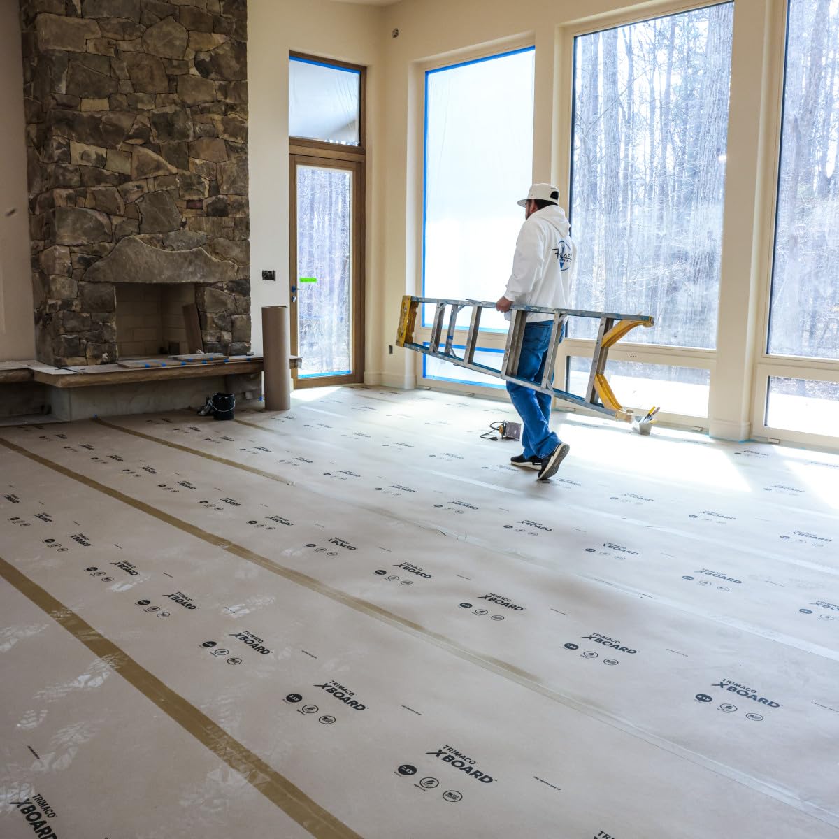 Breathable X-Board protector allowing floor curing beneath.