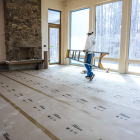 Breathable X-Board protector allowing floor curing beneath.