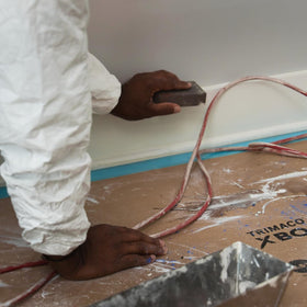 A large 35-inch by 100-foot X-Board roll showing its size.