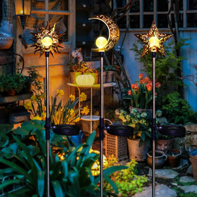 Tryme Star solar garden stake lights add a peaceful glow to flower beds