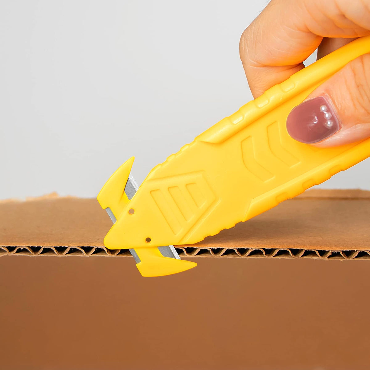 TTOVIA safety cutter with tape splitter nose for quick tape removal.