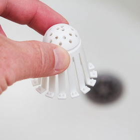 TubShroom Toss easy disposal action showing quick cleanup.