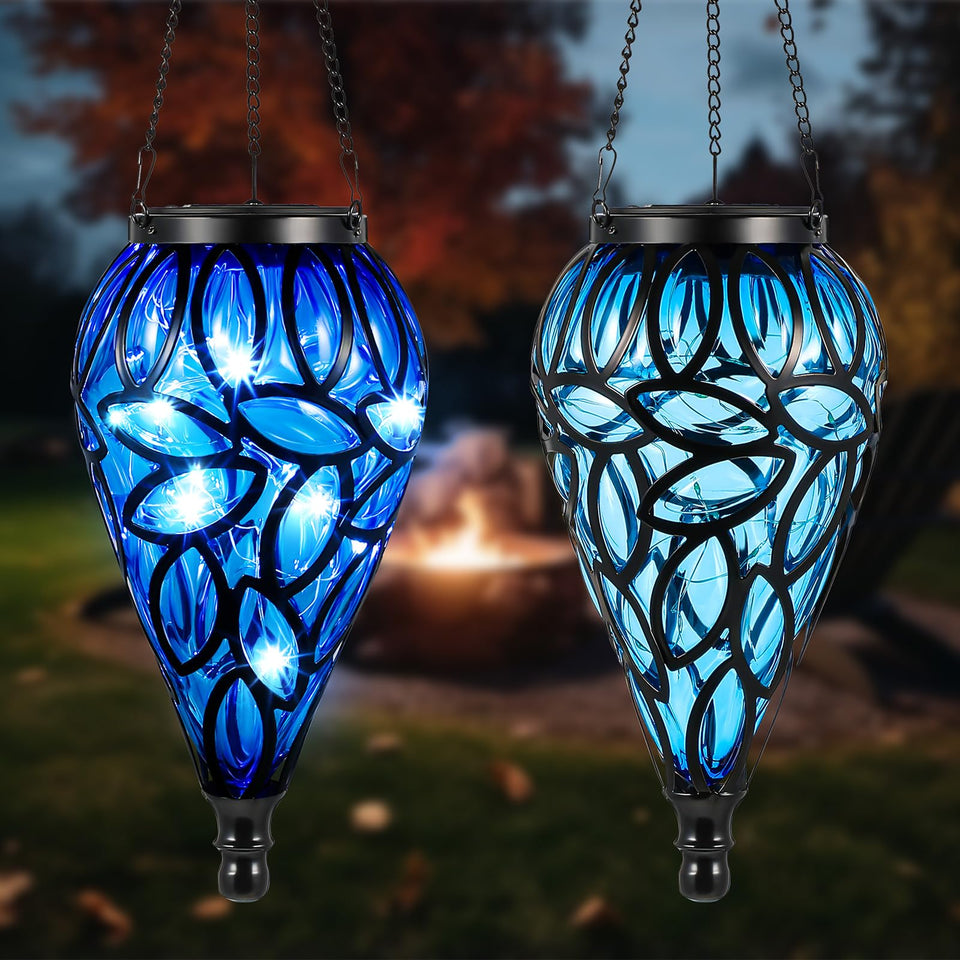 Tujoe blue tear-shaped lanterns create serene outdoor ambiance in a garden.