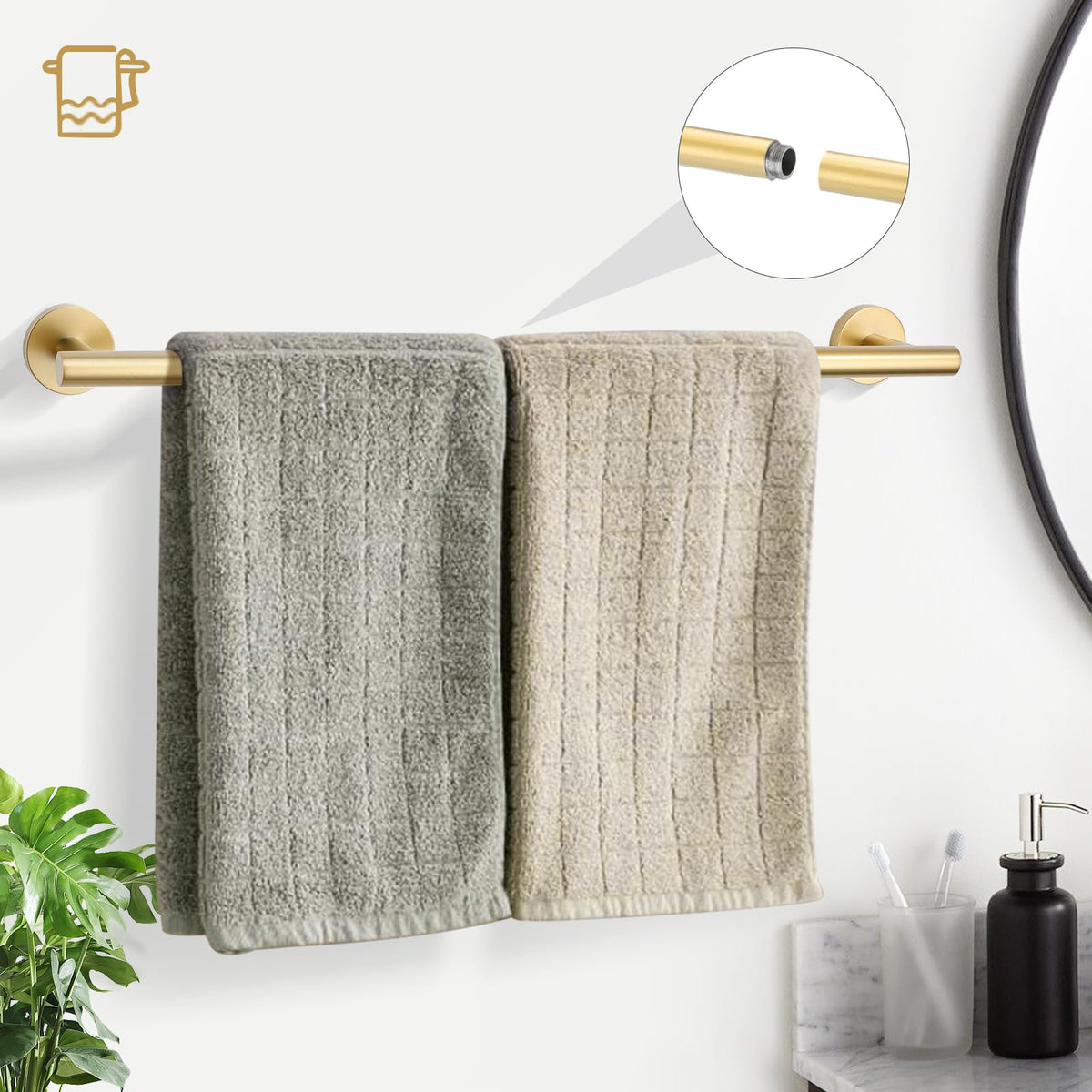The TURS brushed gold 24-inch towel bar mounted for easy towel drying.