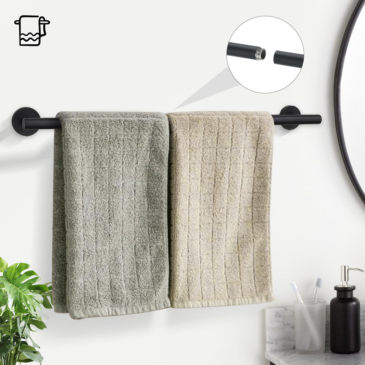 TURS towel ring in matte black complements the towel bar for a cohesive look.